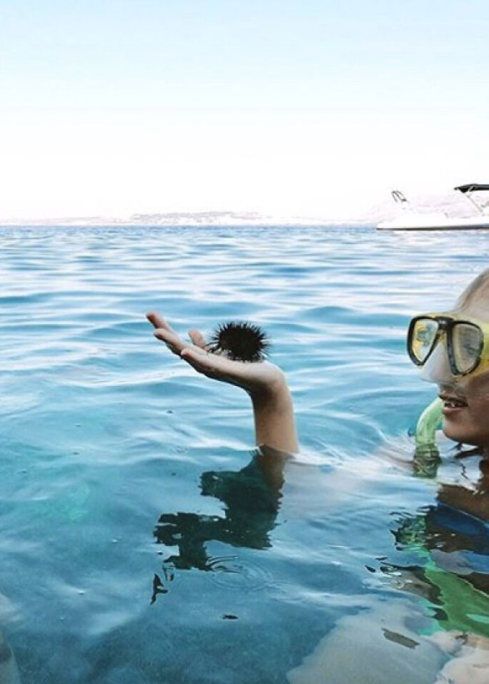Man With Curly Hair About To Dive Into The Water - Confusing Perspective Photos
