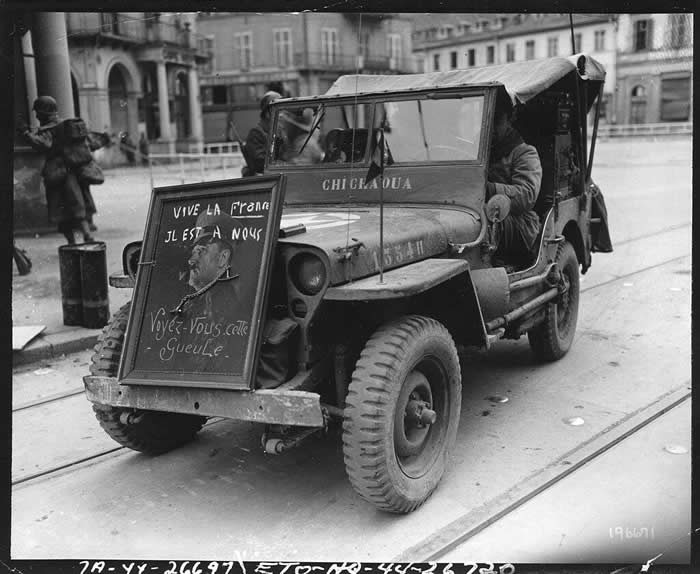 Members of the 1st French Army, in the Mulhouse area, France, decorated this jeep with a captured picture of Hitler: 21 November (1944) - Vintage Rare Historical Photos 