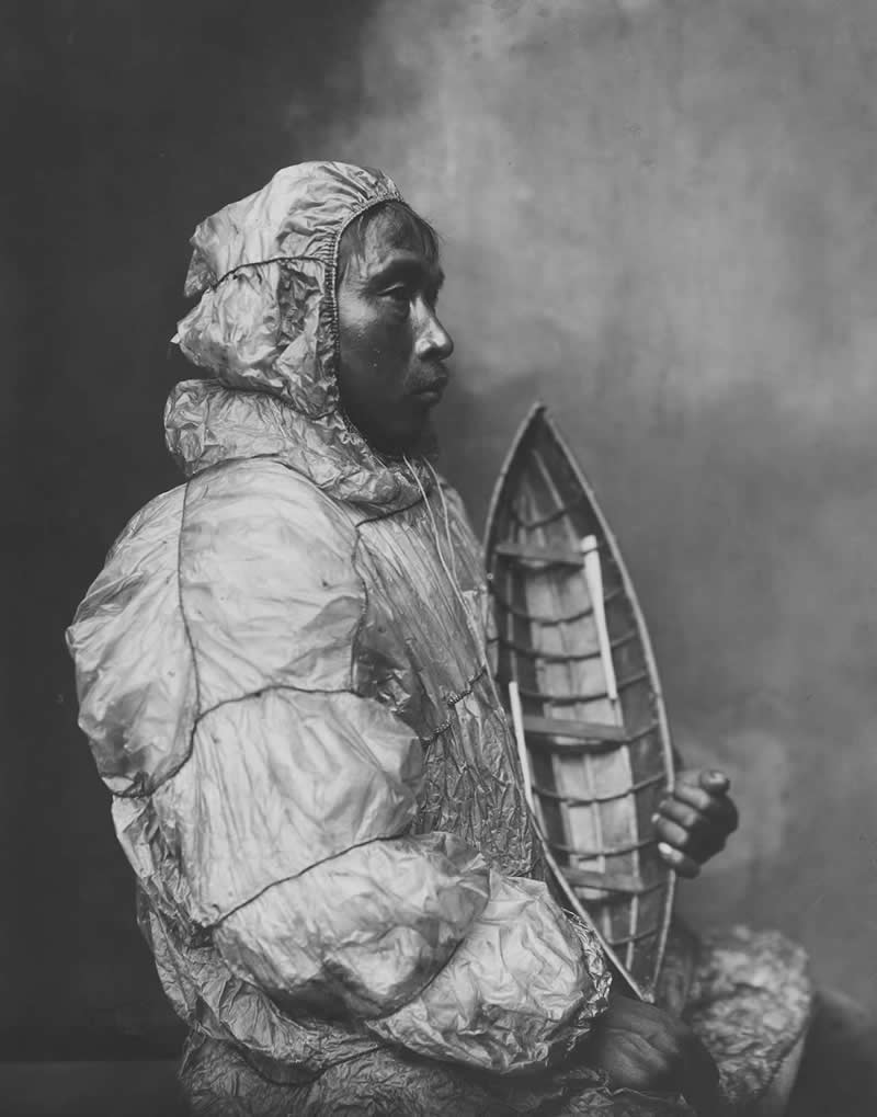 Inuit man sits in a photo studio by Beverly B. Dobbs - Most Iconic Photos From the National Geographic Archives