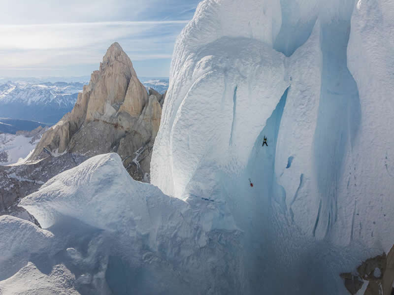 2026 Memorial Maria Luisa Awards: Best Mountain & Nature Photos Revealed 39 A solo climber scaling a steep icy wall on Cerro Torre surrounded by massive glaciers and rugged mountain peaks.