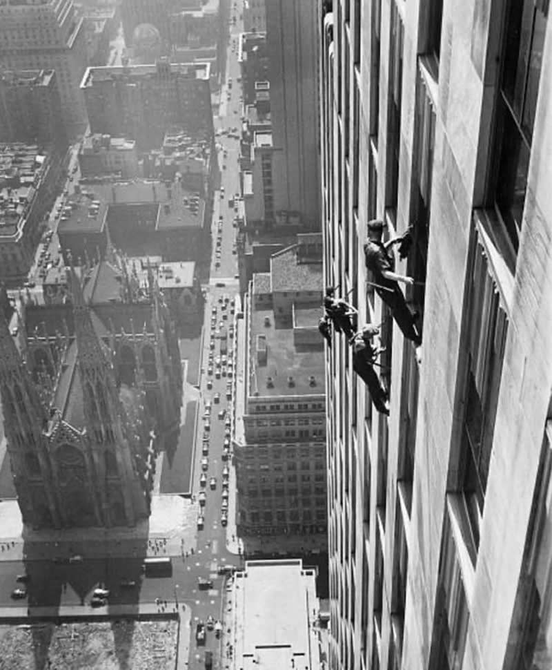 Window cleaners at work on a skyscraper in New York City, 1936.