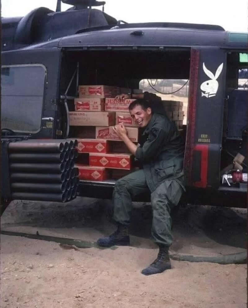 US soldier with a load of precious cargo, Vietnam. (Late 1960s-early 1970s)