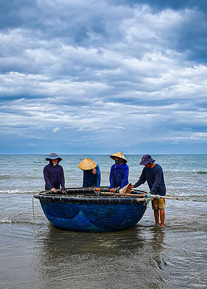 On The Phone In Support Of Action Against Hunger: Timeless Teamwork Traditions - Basket Boat Fishing, Da Nang, Vietnam By Laura Burgon - 2026 Food Photography Awards