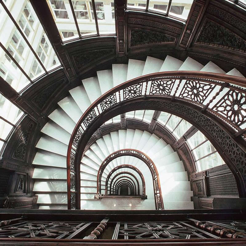 Looking down the spiral staircase of the Sullivan Center in Chicago