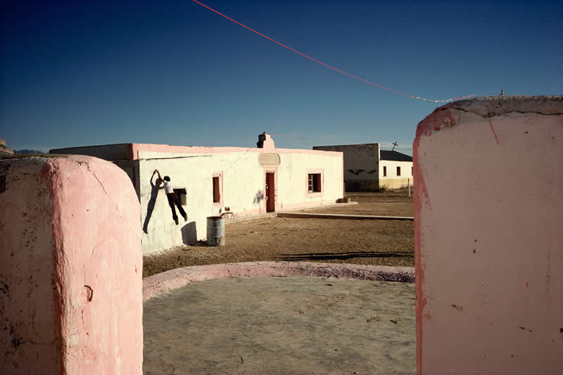 The Suffering of Light Jumping, Boquillas (Border), Mexico by Alex Webb - Iconic Color Photos by Legendary Photographers