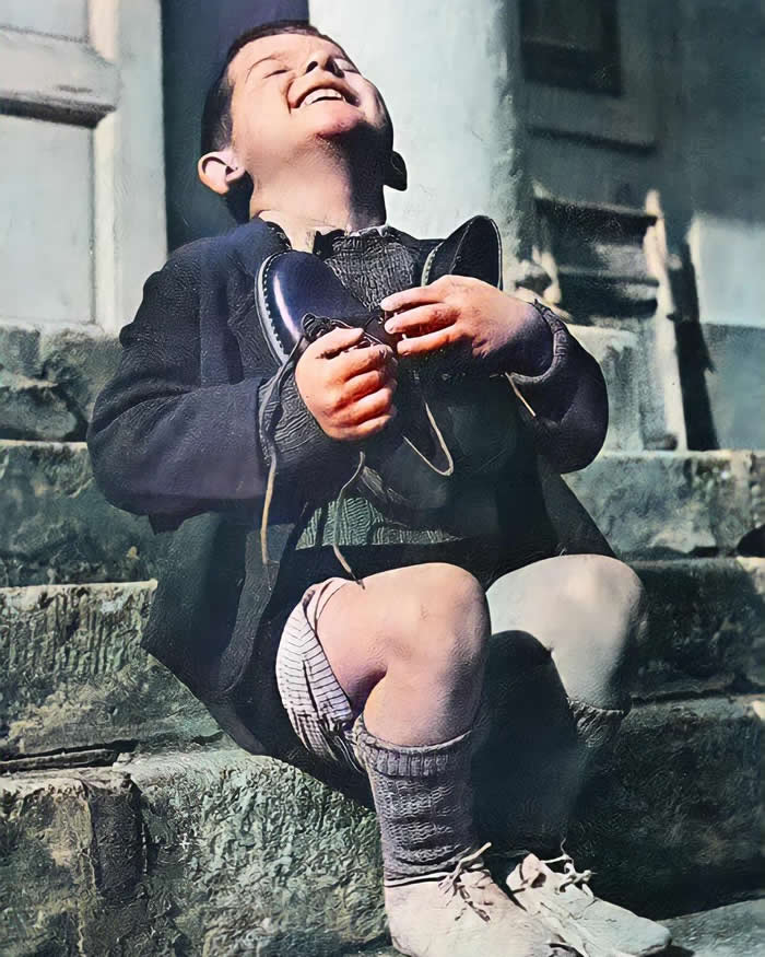 History Reimagined: 33 Rare Color Photos That Bring the Past Back to Life 58 Six-year-old Austrian boy “Werfel” receiveing a new pair of shoes at the Am Himmel orphanage, donated by the Junior Red Cross in America, 1946.