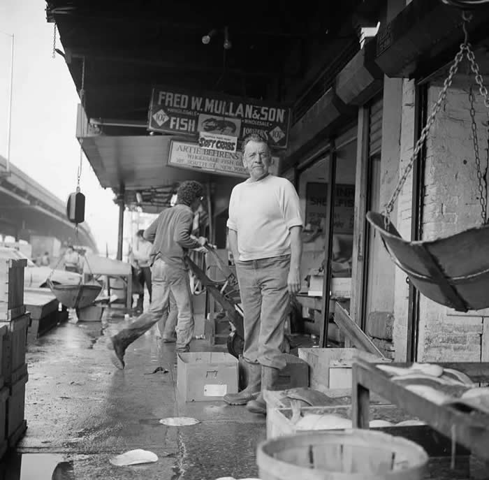 Old New York Revealed: 35 Rare Historical Photos That Capture Forgotten Moments 65 A business owner at the Fulton Fish Market, New York, 1982.
