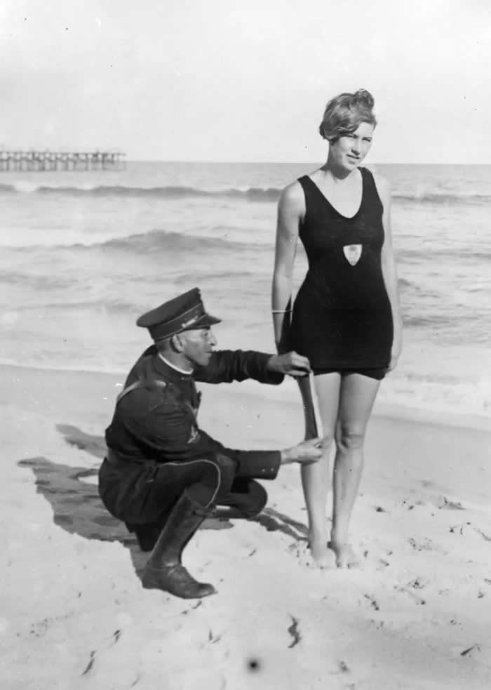 History Uncovered: 40 Powerful Photos That Change How We See the Past 57 Smokey' Buchanan from the West Palm Beach police force, measuring the bathing suit of Betty Fringle on Palm Beach, to ensure that it conforms with regulations introduced by the beach censors.