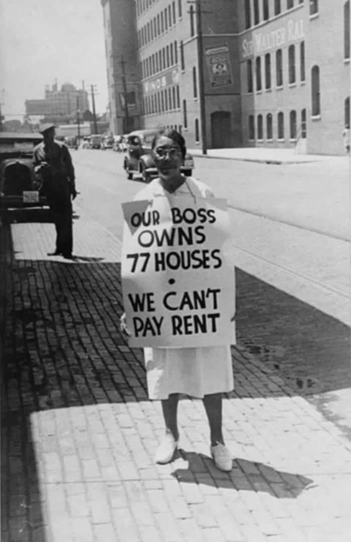 History Uncovered: 40 Powerful Photos That Change How We See the Past 59 A woman holds a sign reading, “Our boss owns 77 houses, we can’t pay rent.” Taken in 1938 in Richmond, Virginia, this photo shows her picketing for higher wages while working at a tobacco company.