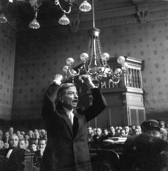 History Uncovered: 40 Powerful Photos That Change How We See the Past 48 Pierre Laval, former Prime Minister of the Vichy French government, passionately pleads his case while on trial for treason at the Palais de Justice in Paris, France. August 1945. Laval was found guilty and exėcuted in October.