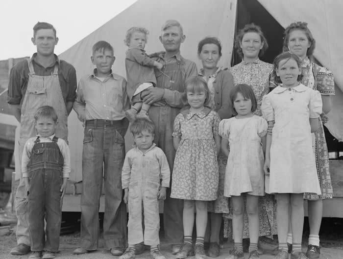 The Past Unfiltered: 36 Rare Historical Photos That Reveal the Human Side of History 48 A migrant farm worker poses with his wife and their ten children at a labor camp in California in 1939. The family had traveled from Mangrum, Oklahoma, leaving behind the hardships of the Dust Bowl era in hopes of finding seasonal work.