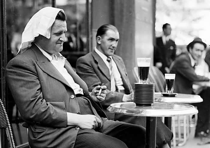Frozen in Time: 38 Powerful Historical Photos That Bring Forgotten Moments Back to Life 74 Overwhelmed by the summer heat, a man sits before a stack of saucers marking the number of drinks he had consumed so far. Paris, France, June 1941, during World War II