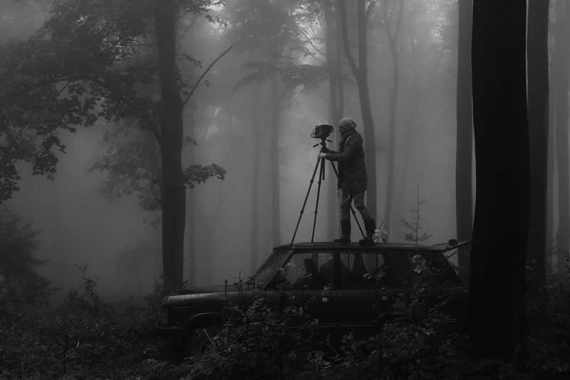 Fading Away (Self-Portrait in a Foggy Wood) by Michał Korta, Poland - Academy Photo Awards 2026 Black and White Winners