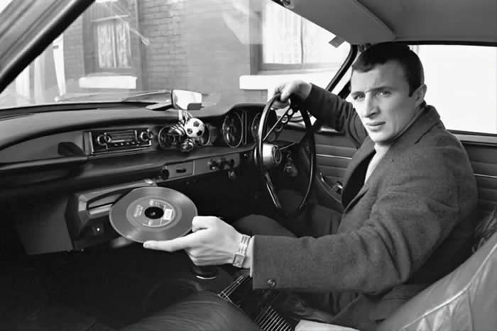 The Past Unfiltered: 34 Rare Historical Photos That Reveal the Human Side of History 40 Manchester City player Mike Summerbee demonstrating the built- in record player of his new Volvo P1800 (1967).