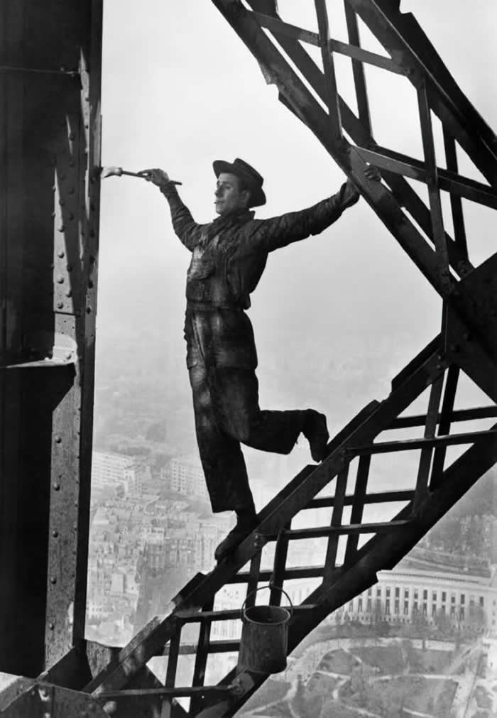 The Past Unfiltered: 34 Rare Historical Photos That Reveal the Human Side of History 46 Eiffel Tower Painter, 1953 (Photo by Marc Riboud)