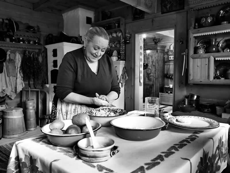 Where the Earth Remembers: Oliver Klink's Moving Portrait of Rural Life and Memory 37 Cooking Traditional Food, Waiting Family Returns, Poland - Where the Earth Remembers by Oliver Klink